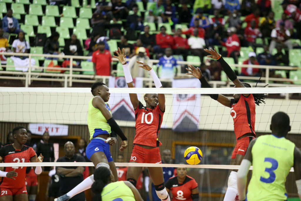 Kenya Pipeline's Pamela Adhiambo and Triza Atuka attempt to block a spike from KCB's Belinda Barasa. PHOTO/Raymond Makhaya